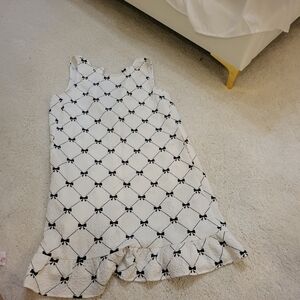 Sleeveless White Dress with Black Bow Pattern